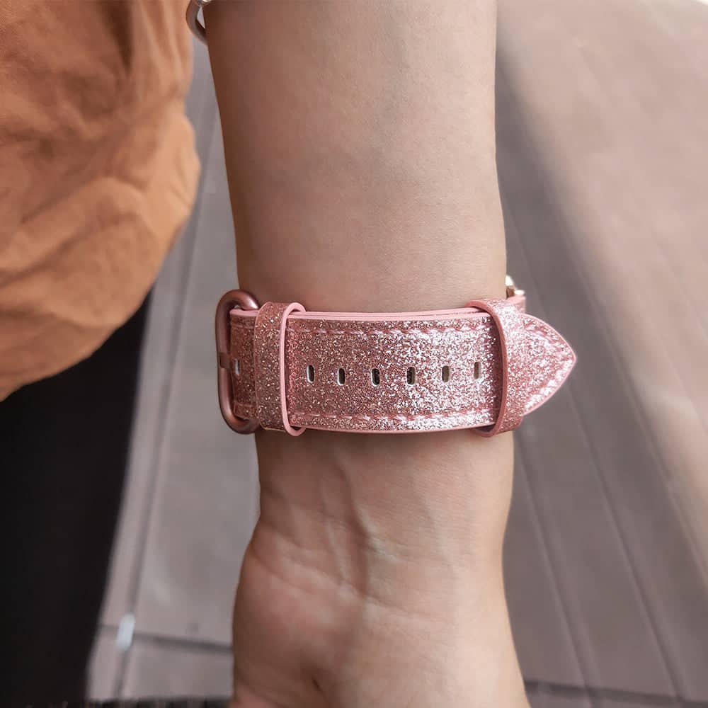 Pink glitter leather Apple Watch strap on wrist